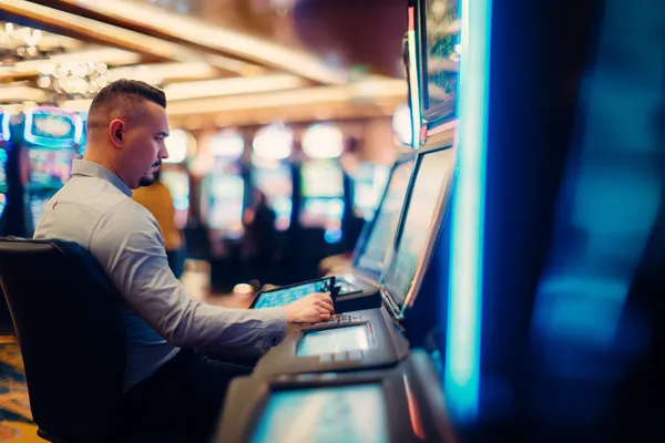 A young woman relaxing with her phone while dynamic casino elements float around her, illustrating the smooth mobile experience offered by the SOUL776 app.