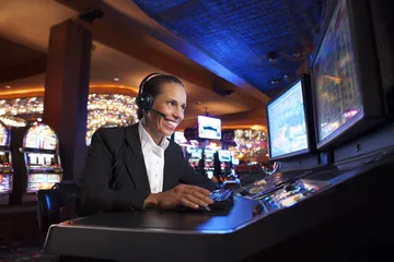 A cheerful woman in traditional clothing using her smartphone during a festive moment, showing how easily the SOUL776 app fits into everyday life.