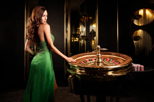 A person using their device against a moody casino-themed background, illustrating the smooth re-entry process at SOUL776.